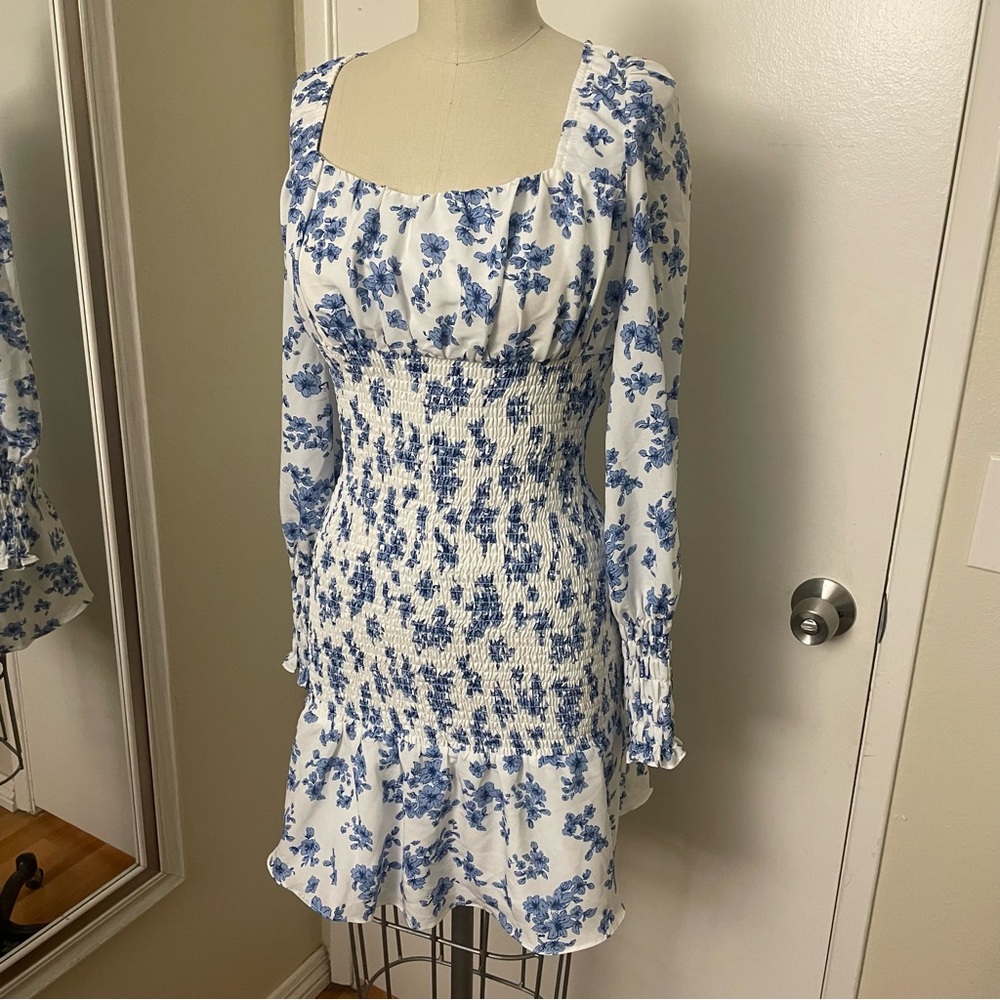 Blue floral mini dress with ruffle sleeves and smocked waist in size S